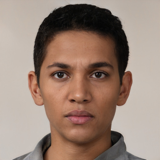 Neutral latino young-adult male with short  black hair and brown eyes