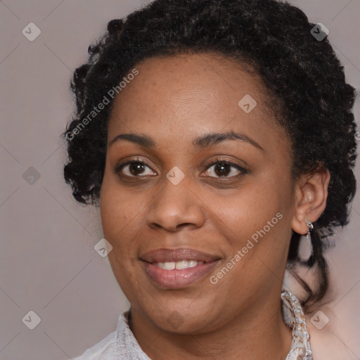 Joyful black young-adult female with medium  brown hair and brown eyes