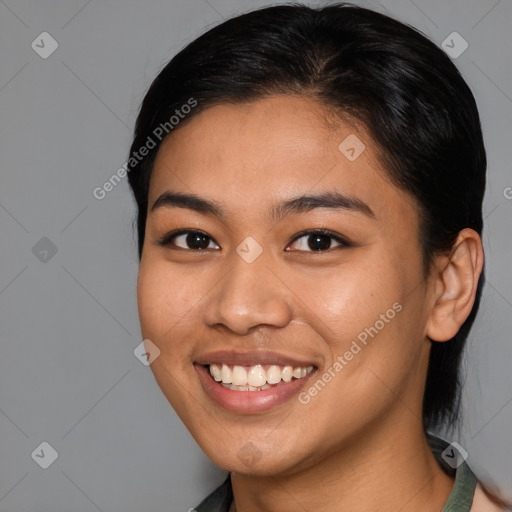 Joyful latino young-adult female with medium  brown hair and brown eyes