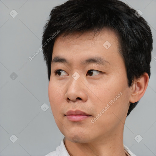 Neutral asian young-adult male with short  black hair and brown eyes