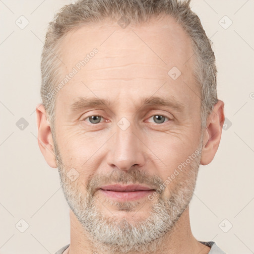 Joyful white adult male with short  brown hair and grey eyes