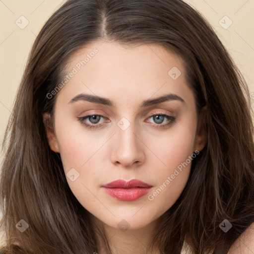 Neutral white young-adult female with long  brown hair and brown eyes