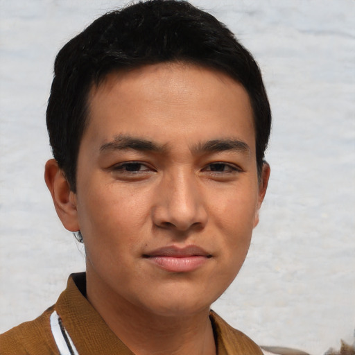 Joyful asian young-adult male with short  brown hair and brown eyes