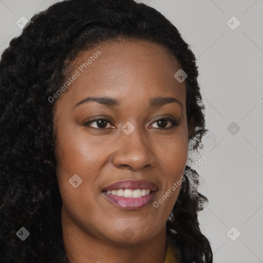 Joyful black young-adult female with long  brown hair and brown eyes