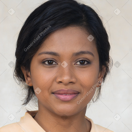 Joyful black young-adult female with medium  brown hair and brown eyes