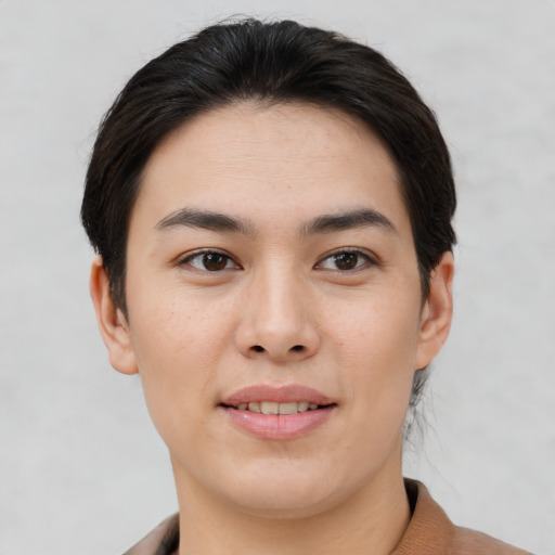 Joyful white young-adult female with short  brown hair and brown eyes