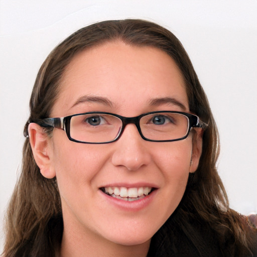 Joyful white young-adult female with long  brown hair and blue eyes