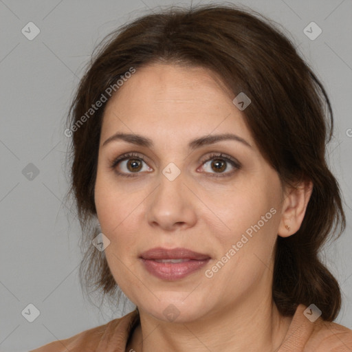 Joyful white adult female with medium  brown hair and brown eyes