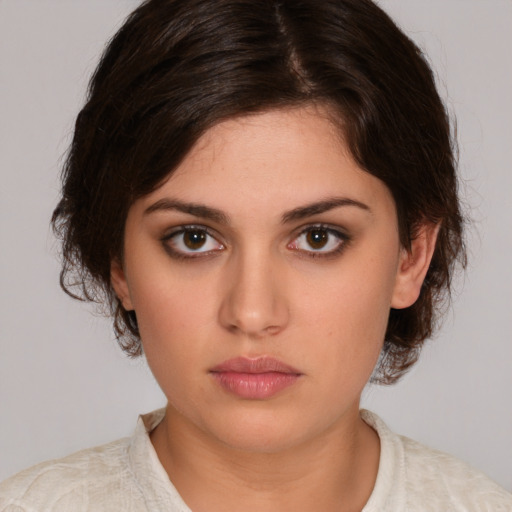 Neutral white young-adult female with medium  brown hair and brown eyes