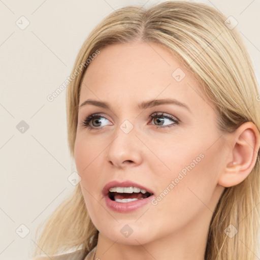 Joyful white young-adult female with long  brown hair and blue eyes