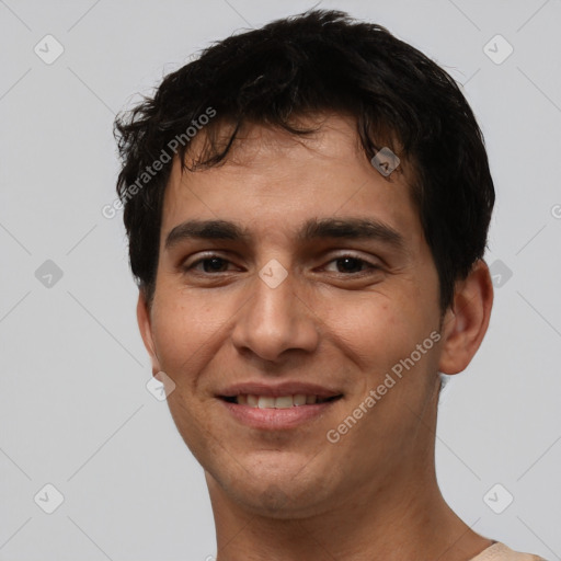 Joyful white young-adult male with short  black hair and brown eyes