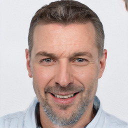 Joyful white adult male with short  brown hair and grey eyes