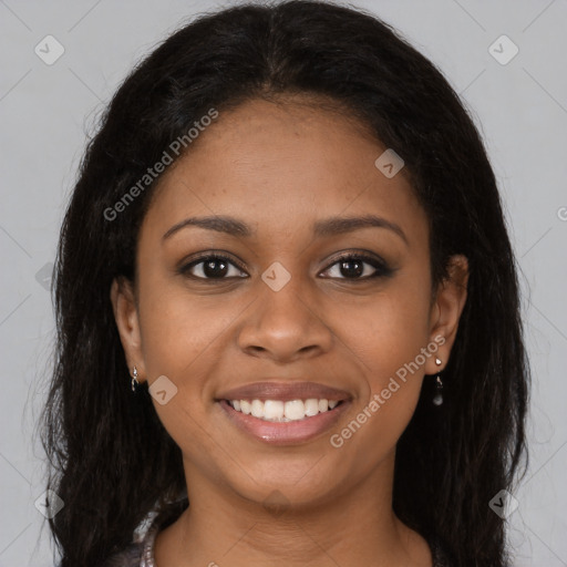 Joyful black young-adult female with long  brown hair and brown eyes