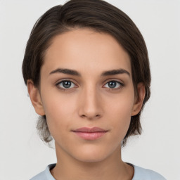 Neutral white young-adult female with medium  brown hair and brown eyes