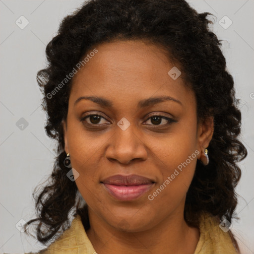 Joyful black young-adult female with long  brown hair and brown eyes