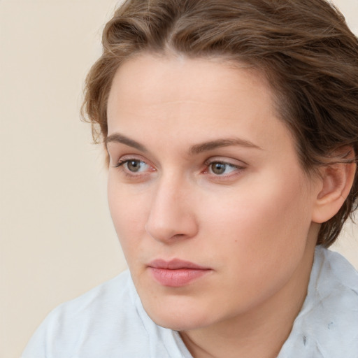 Neutral white young-adult female with short  brown hair and brown eyes