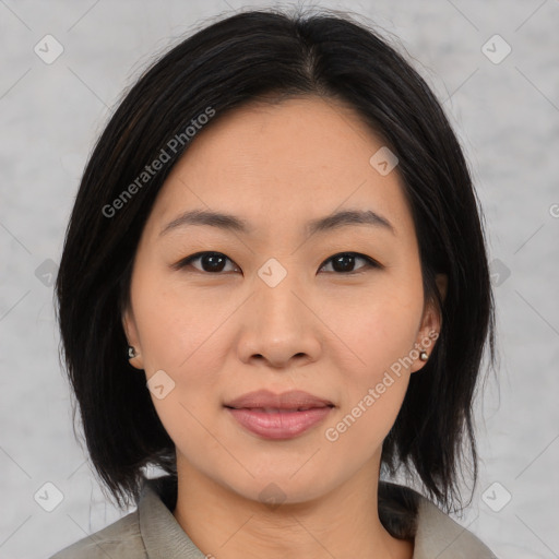 Joyful asian young-adult female with medium  black hair and brown eyes