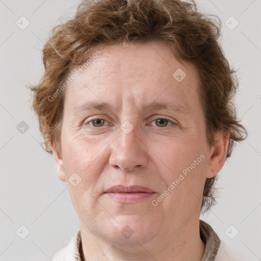 Joyful white adult female with short  brown hair and grey eyes