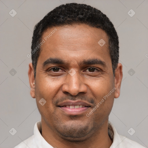 Joyful latino adult male with short  black hair and brown eyes