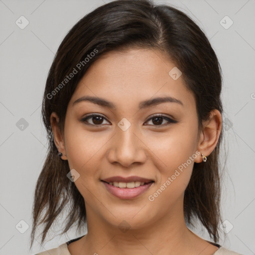 Joyful latino young-adult female with medium  brown hair and brown eyes