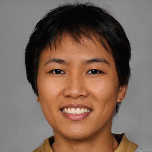 Joyful asian young-adult female with medium  brown hair and brown eyes
