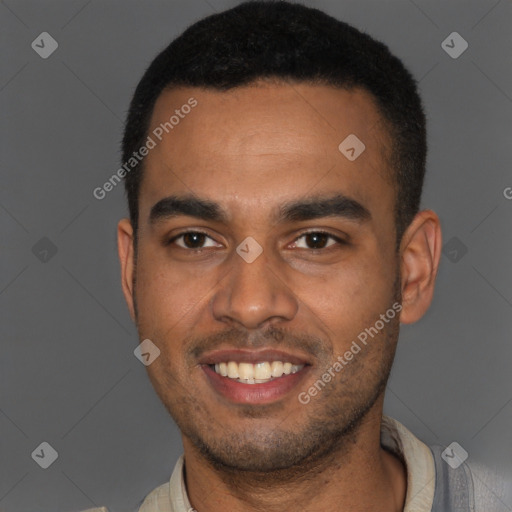 Joyful black young-adult male with short  black hair and brown eyes