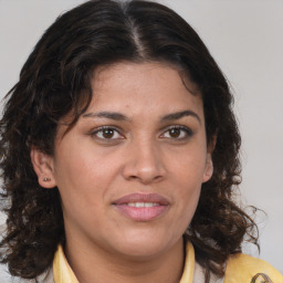 Joyful white adult female with medium  brown hair and brown eyes