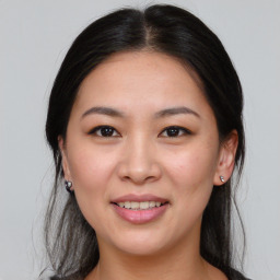 Joyful asian young-adult female with medium  brown hair and brown eyes