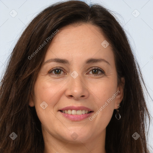 Joyful white adult female with long  brown hair and brown eyes