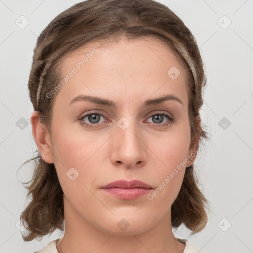 Neutral white young-adult female with medium  brown hair and grey eyes