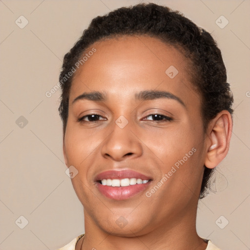 Joyful latino young-adult female with short  brown hair and brown eyes