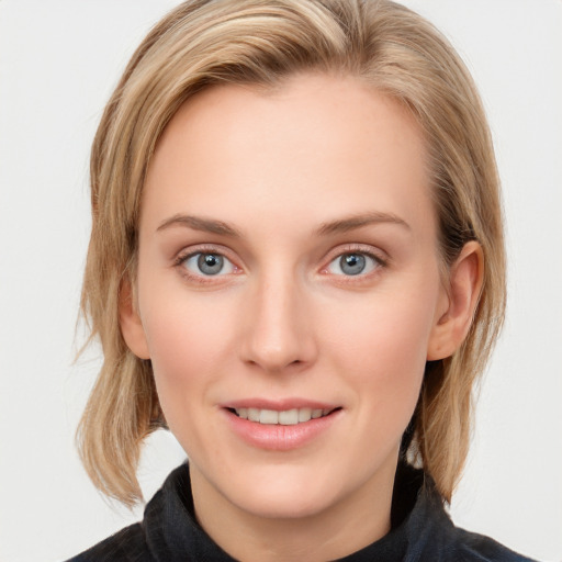 Joyful white young-adult female with medium  brown hair and blue eyes