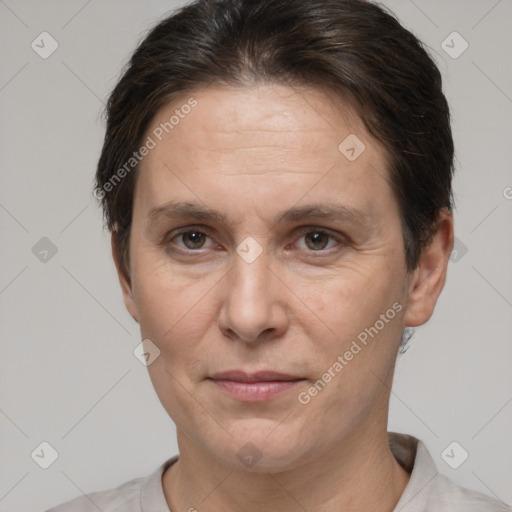 Joyful white adult female with short  brown hair and brown eyes