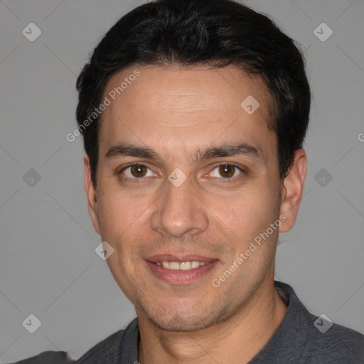 Joyful white adult male with short  black hair and brown eyes