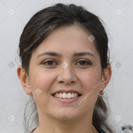 Joyful white young-adult female with medium  brown hair and grey eyes