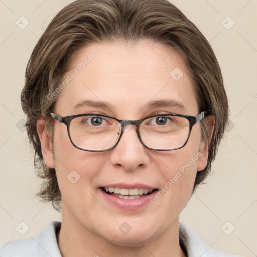 Joyful white adult female with medium  brown hair and blue eyes