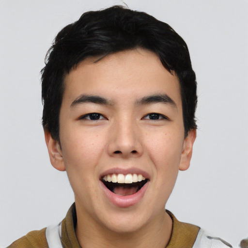 Joyful asian young-adult male with short  black hair and brown eyes