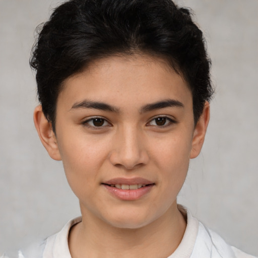 Joyful latino young-adult female with short  brown hair and brown eyes
