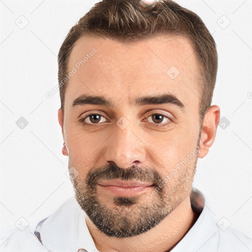 Joyful white adult male with short  brown hair and brown eyes