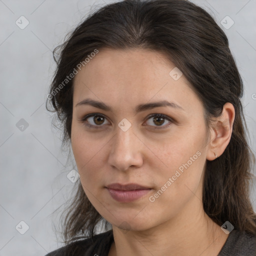 Joyful white adult female with long  brown hair and brown eyes