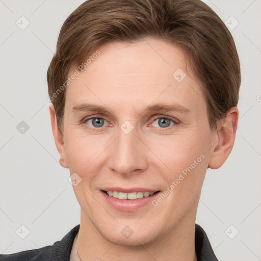 Joyful white adult female with short  brown hair and grey eyes