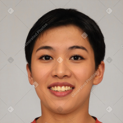 Joyful asian young-adult female with short  black hair and brown eyes