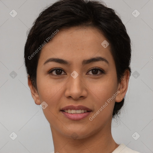 Joyful asian young-adult female with short  brown hair and brown eyes