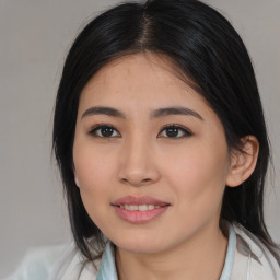 Joyful asian young-adult female with medium  brown hair and brown eyes