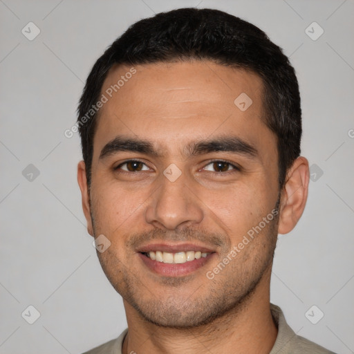 Joyful white young-adult male with short  black hair and brown eyes