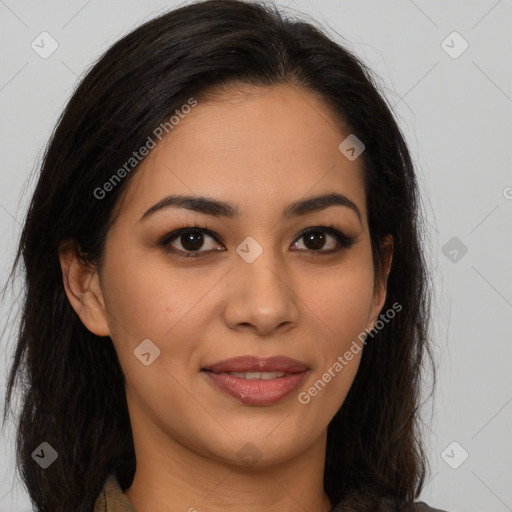 Joyful latino young-adult female with long  brown hair and brown eyes