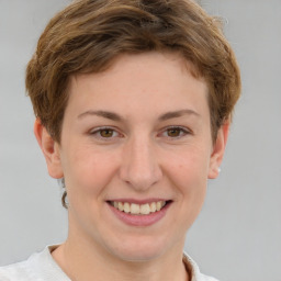 Joyful white young-adult female with short  brown hair and grey eyes