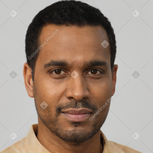 Joyful black young-adult male with short  black hair and brown eyes