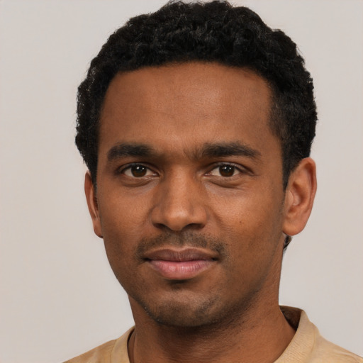 Neutral black young-adult male with short  black hair and brown eyes