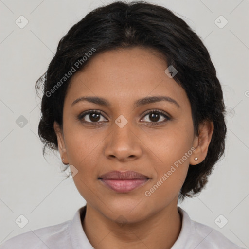 Joyful latino young-adult female with medium  brown hair and brown eyes